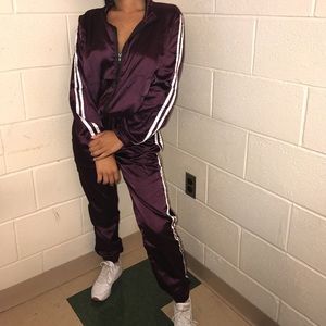 Purple track suit.